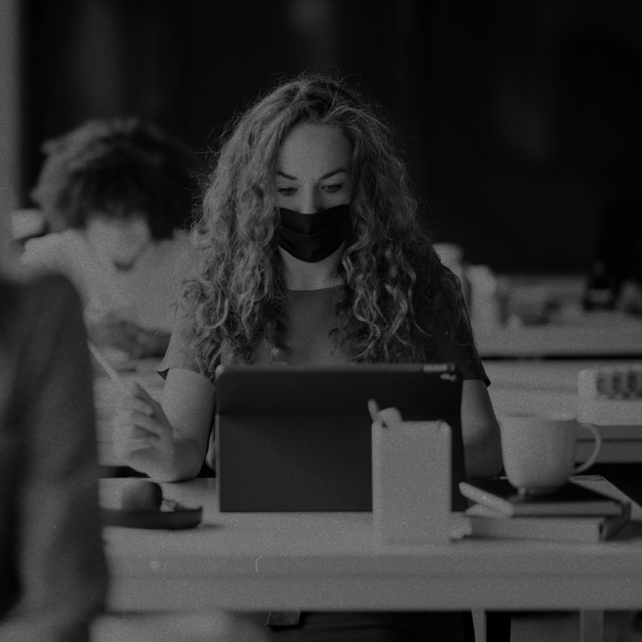 Woman wearing a mask while working in the office.
